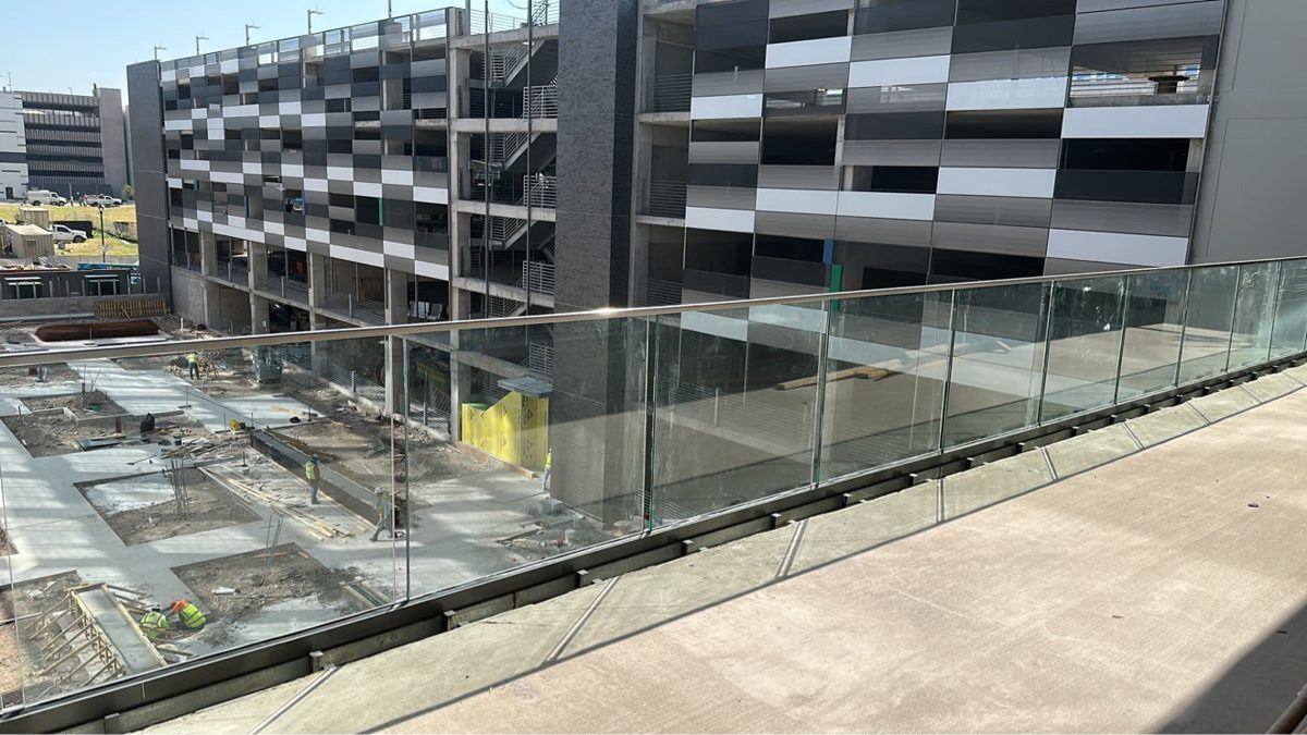 Glass railing — crew on site