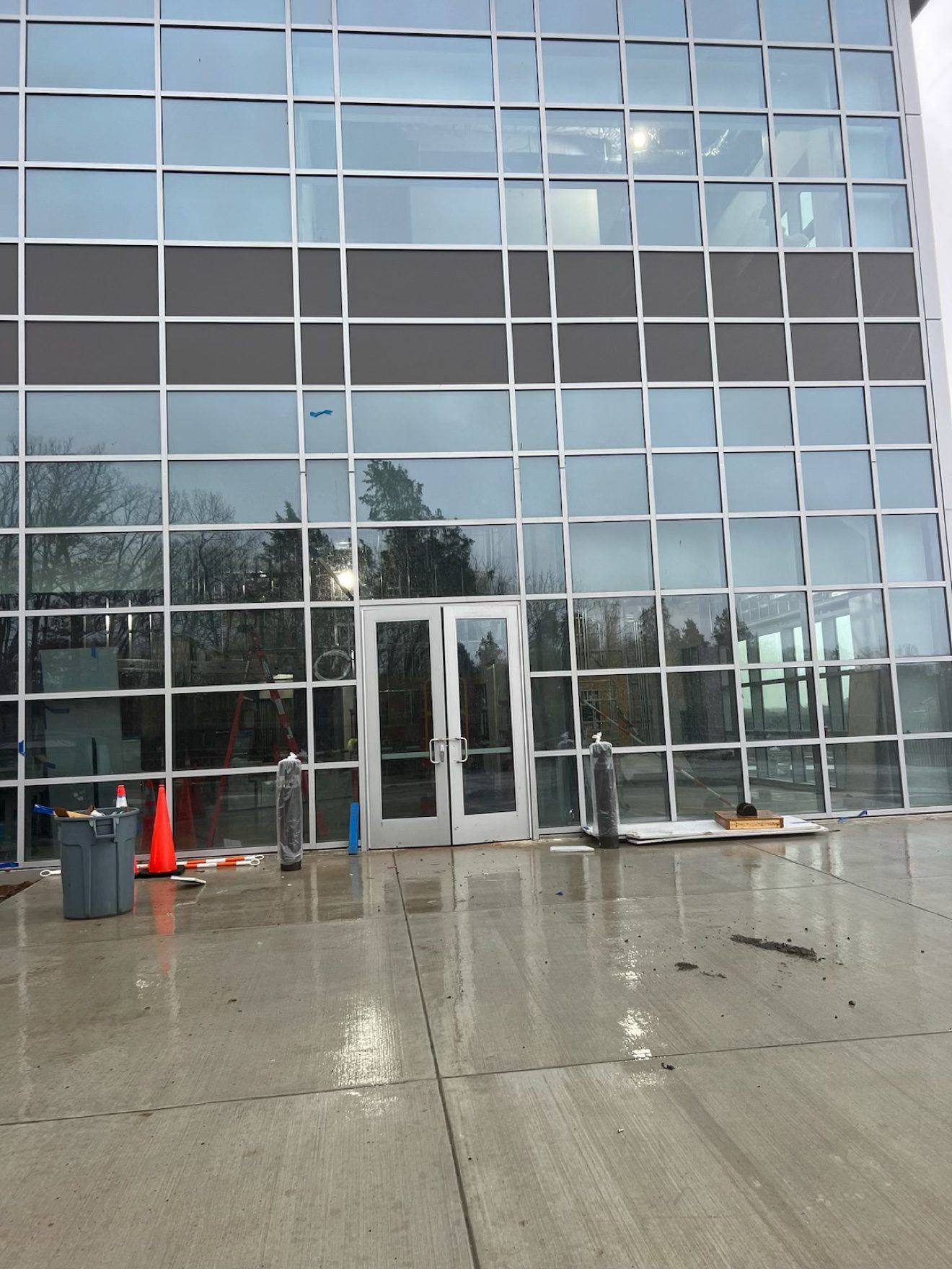 Crew installing storefront frames and doors